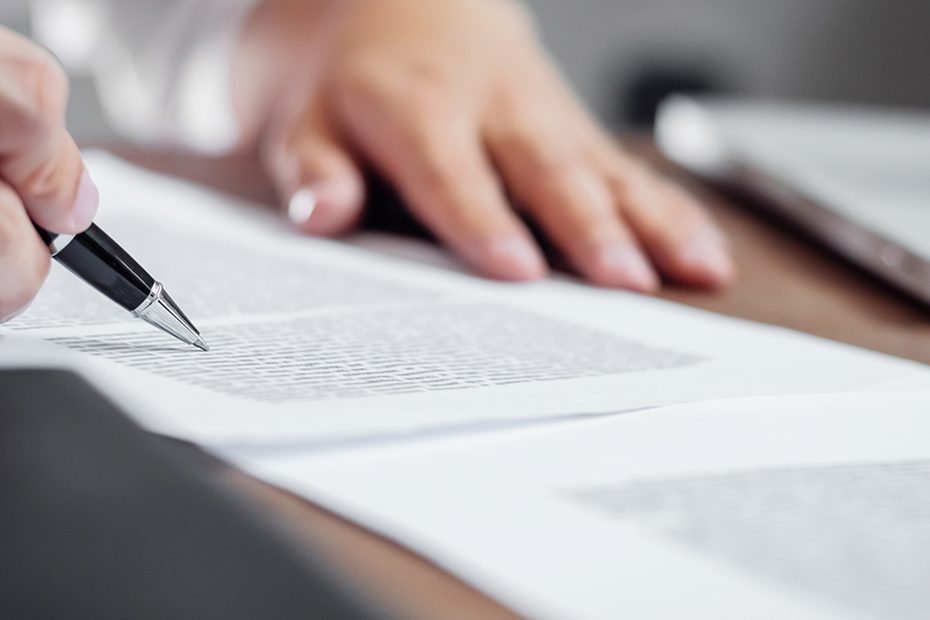 Person signing a legal document