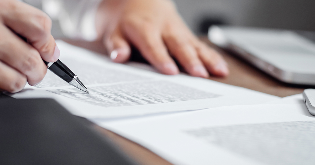 Person signing a legal document