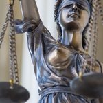 Statue of Lady Justice holding scales