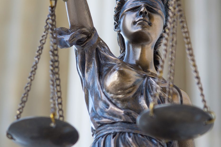 Statue of Lady Justice holding scales