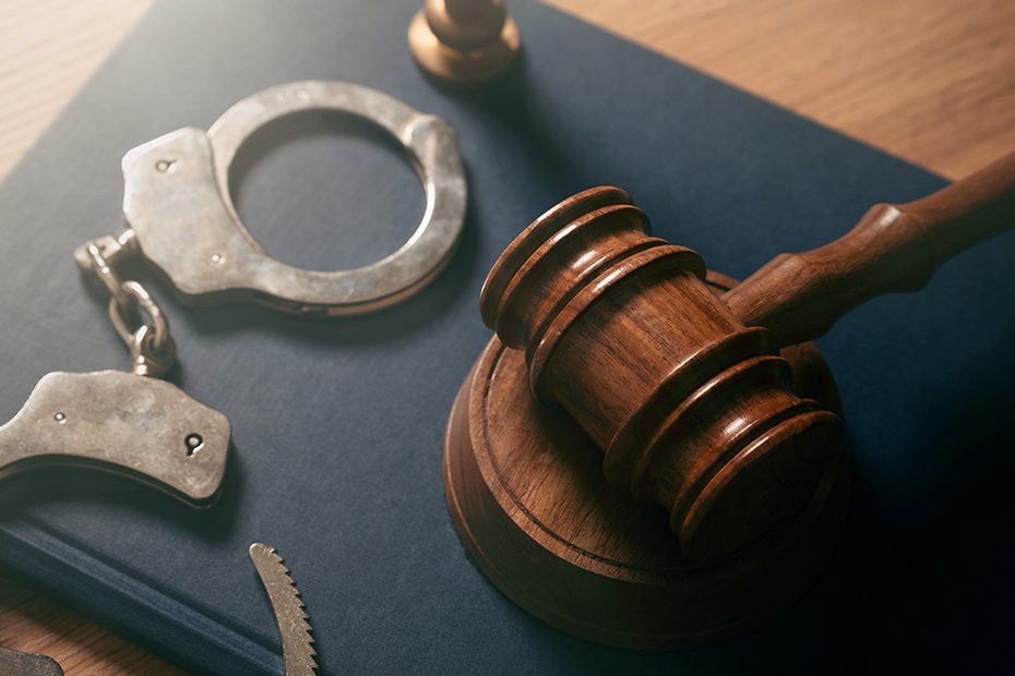 Handcuffs and a judge's gavel