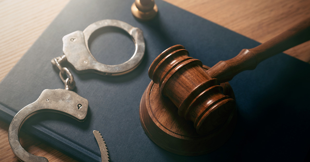 Handcuffs and a judge's gavel