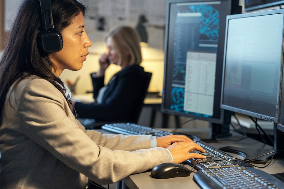 Analysts working at computer monitors