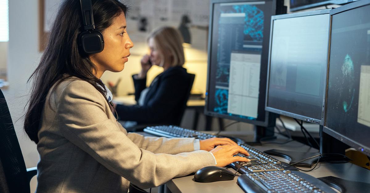 Analysts working at computer monitors